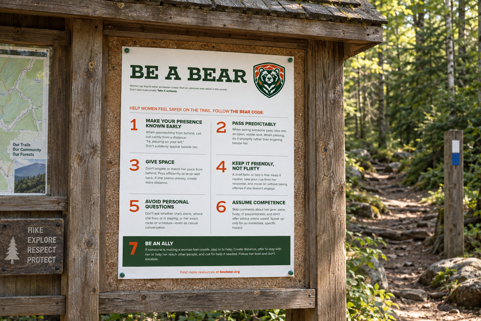 The Be a Bear poster displayed on a wooden trailhead information board in the forest